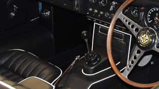 header-opalescent-silver-blue-jaguar-e-type-seats-and-steering-wheel