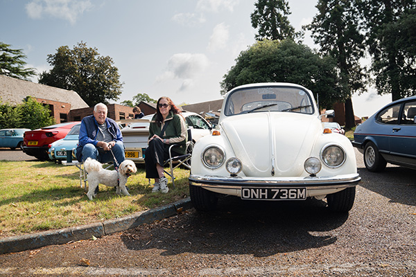 Kathryn, Bernie and their dog Bonnie With Their White 1972 Volkswagen Beetle