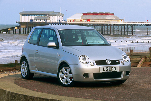 Silver 1999-05 VW Lupo GTi beach edge, groynes and Cromer Pier Backdrop