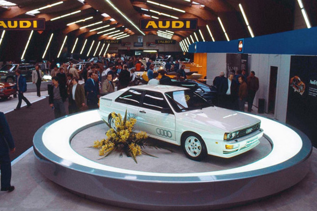 white-1980-audi-ur-quattro-on-a-circular-plinth-at-a-motor-show