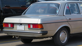 header-of-silver-1975-1986-mercedes-benz-w123-in-car-park