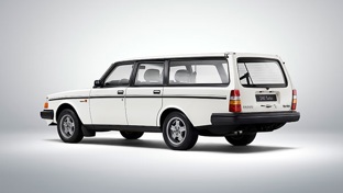 A white Volvo 240 with a grey background
