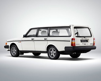 A white Volvo 240 with a grey background