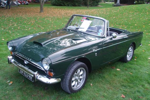 A green Minilite Sunbeam parked on grass